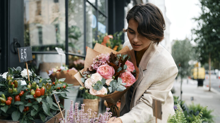 Woman looks at flowers at Orchard Place