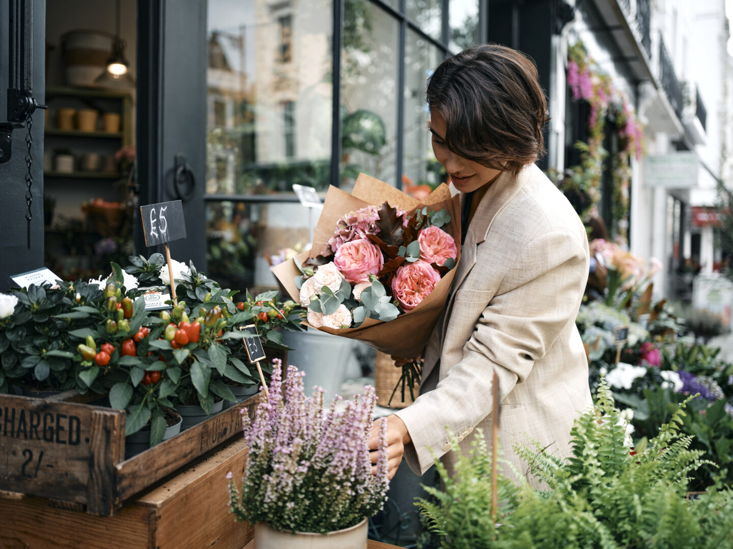Woman selects flowers at Orchard Place
